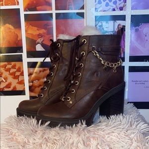 Brown heeled boots w/ fur on the inside.